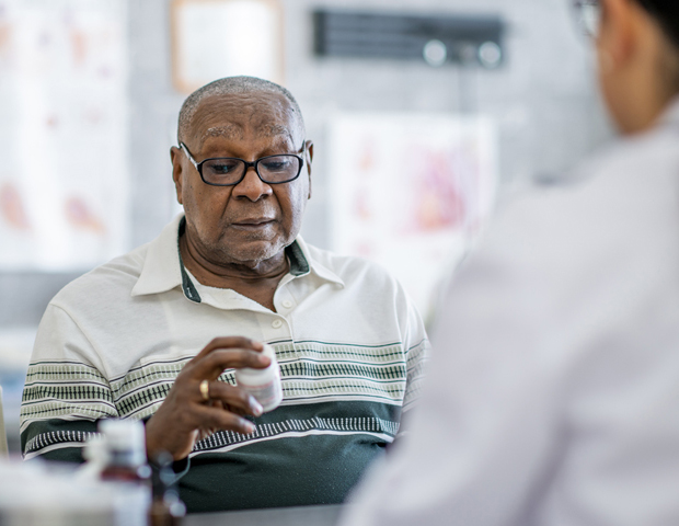 man looking at pills_sum copy.jpg